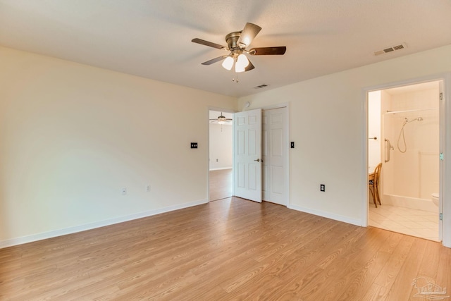 3881 Windsor Castle Blvd, Milton, FL 32583 - unfurnished bedroom with light wood-type flooring, baseboards, ensuite bathroom, and ceiling fan