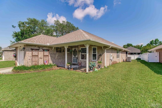 3881 Windsor Castle Blvd, Milton, FL 32583 - view of front of property with brick siding, central air condition unit, a garage, a shingled roof, and covered porch