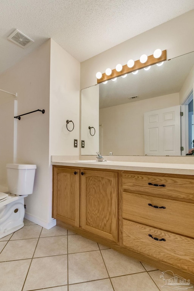 3881 Windsor Castle Blvd, Milton, FL 32583 - bathroom with vanity, tile patterned floors, and toilet
