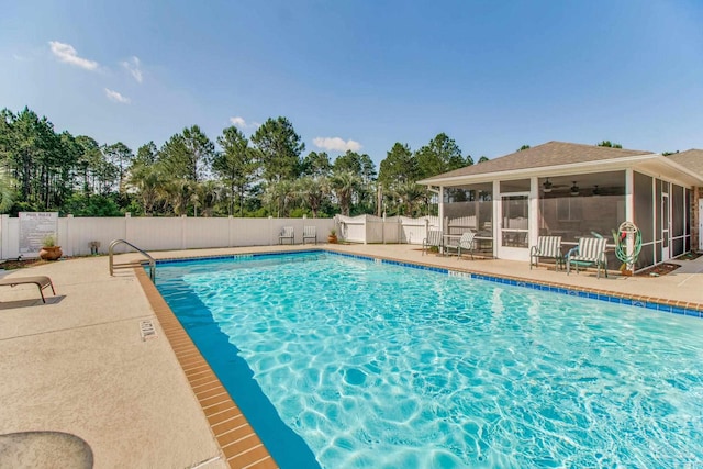 3881 Windsor Castle Blvd, Milton, FL 32583 - community pool with a sunroom, fence, and a patio
