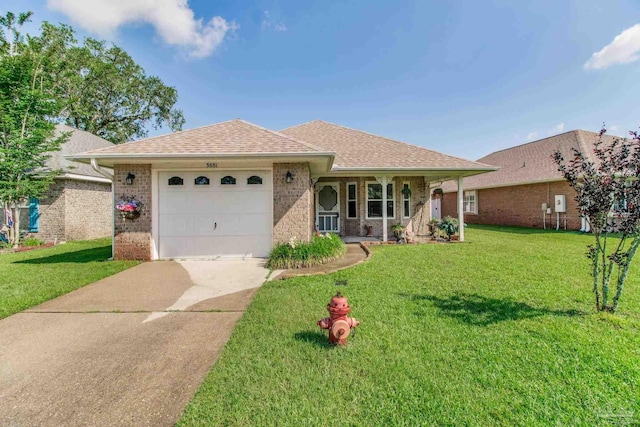3881 Windsor Castle Blvd, Milton, FL 32583 - ranch-style house with concrete driveway, a garage, a front lawn, brick siding, and roof with shingles