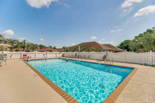 3881 Windsor Castle Blvd, Milton, FL 32583 - community pool featuring a patio area and fence
