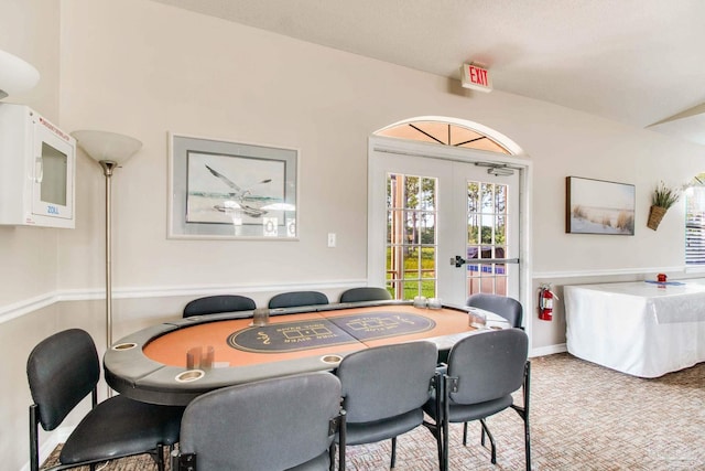 3881 Windsor Castle Blvd, Milton, FL 32583 - dining space featuring french doors, vaulted ceiling, and carpet floors