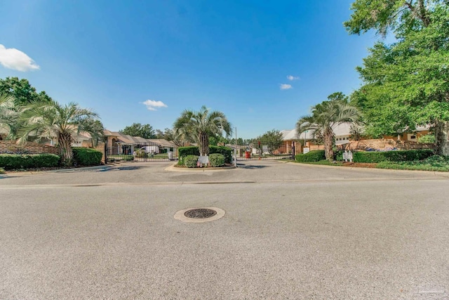 3881 Windsor Castle Blvd, Milton, FL 32583 - view of property hidden behind natural elements featuring a gate and fence