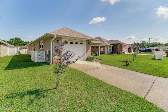 3881 Windsor Castle Blvd, Milton, FL 32583 - ranch-style home featuring a garage, driveway, brick siding, and roof with shingles