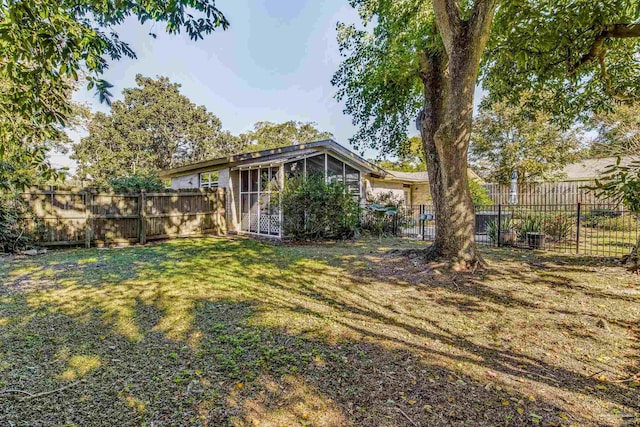 view of yard with a sunroom