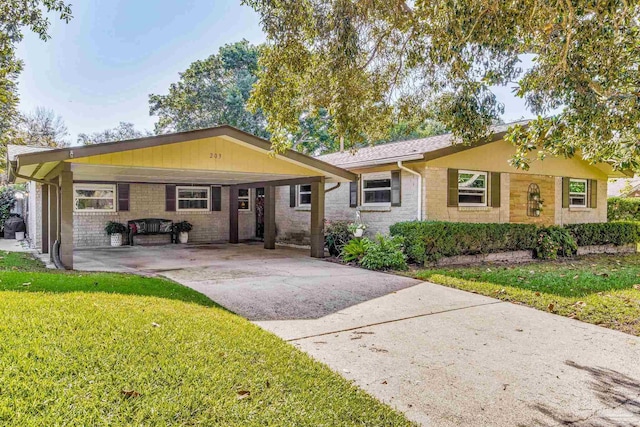 ranch-style house with a front yard and a carport