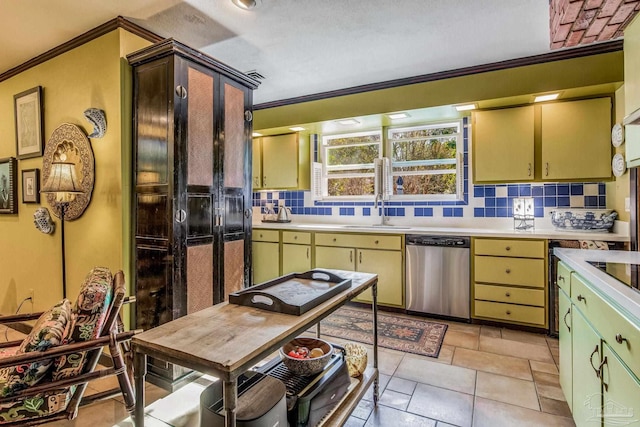 kitchen featuring dishwasher, crown molding, decorative backsplash, and sink