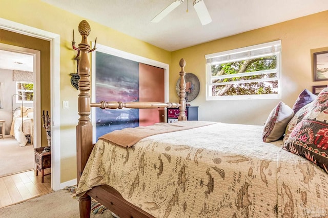 bedroom with ceiling fan and hardwood / wood-style floors