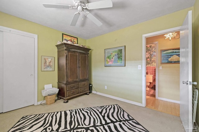 carpeted bedroom with ceiling fan