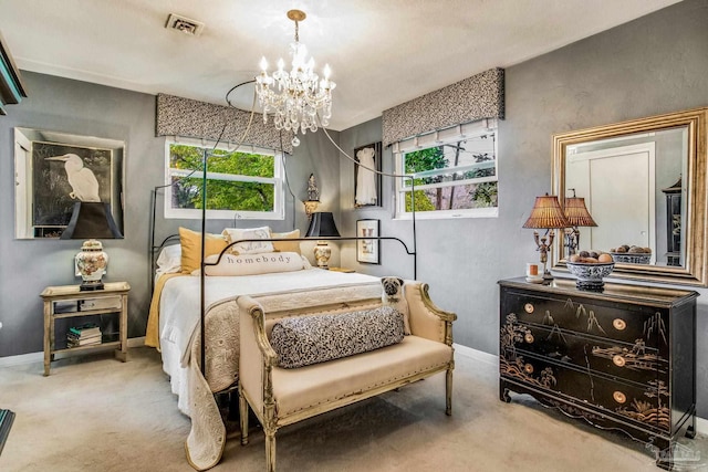 bedroom with carpet floors and an inviting chandelier