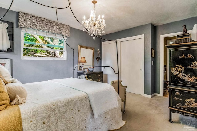 bedroom with an inviting chandelier, light colored carpet, and a closet