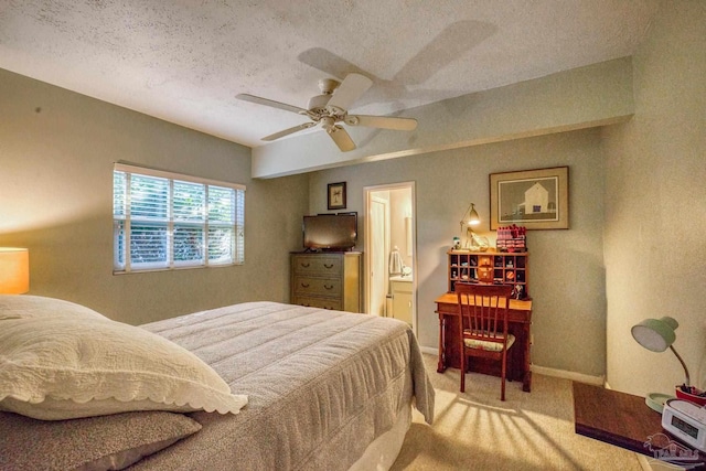 bedroom featuring ceiling fan, carpet, and a textured ceiling