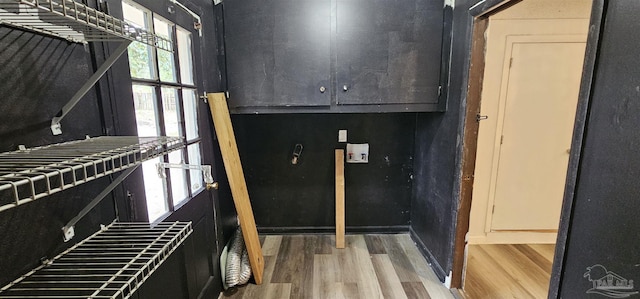 interior space featuring light wood-type flooring and tile counters