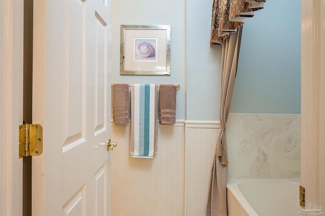 bathroom with a washtub