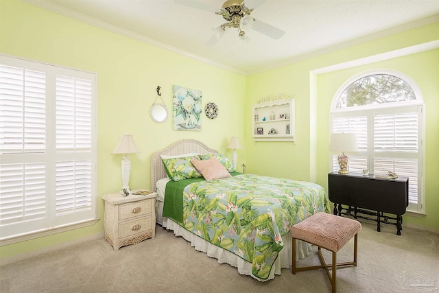 bedroom with ornamental molding, carpet flooring, and ceiling fan