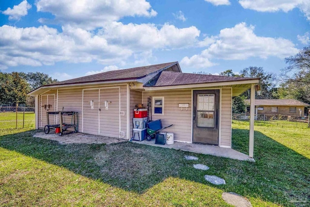view of outbuilding with fence