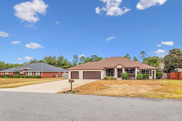 ranch-style home with a front yard and a garage