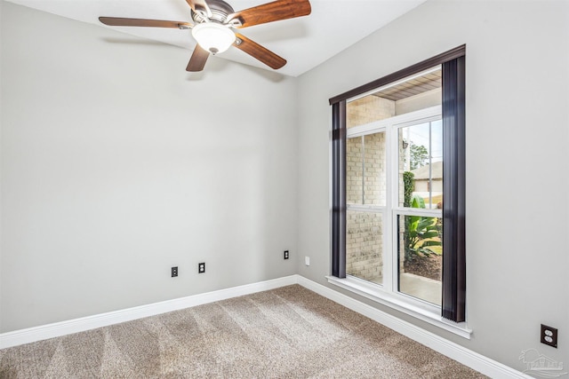 carpeted empty room featuring ceiling fan