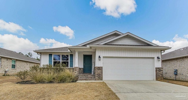 view of front of property with a garage and a front yard