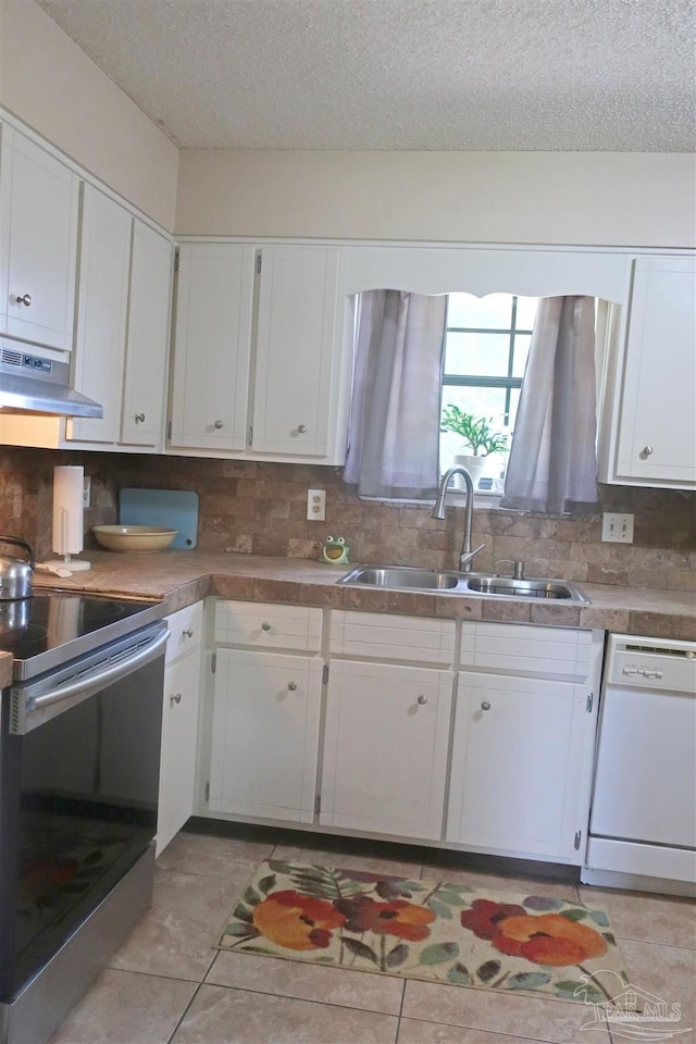 6150 Forest Pines Dr, Pensacola, FL 32526 - kitchen with dishwasher, a sink, stainless steel electric range oven, ventilation hood, and a textured ceiling