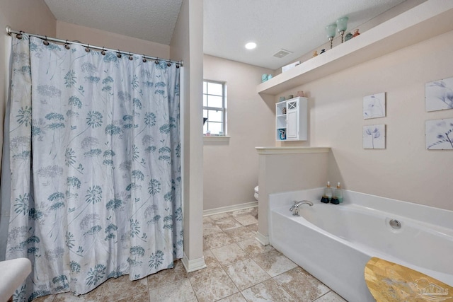 bathroom with toilet, independent shower and bath, and a textured ceiling