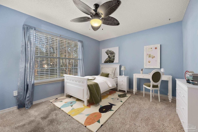 bedroom featuring ceiling fan, a textured ceiling, and light carpet