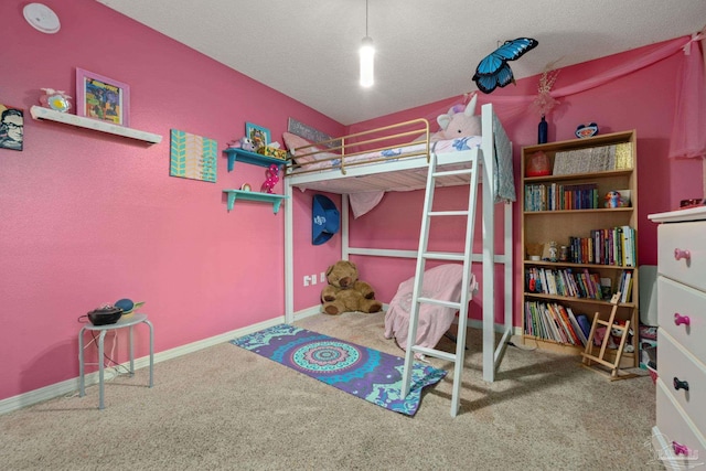 bedroom featuring carpet floors and a textured ceiling