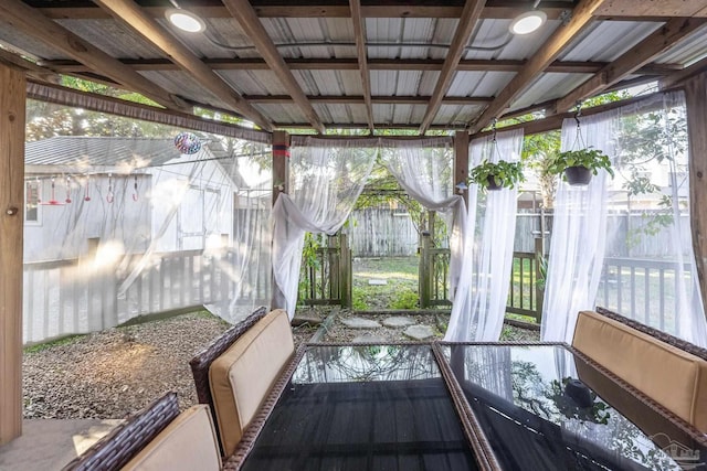 sunroom with a wealth of natural light and vaulted ceiling