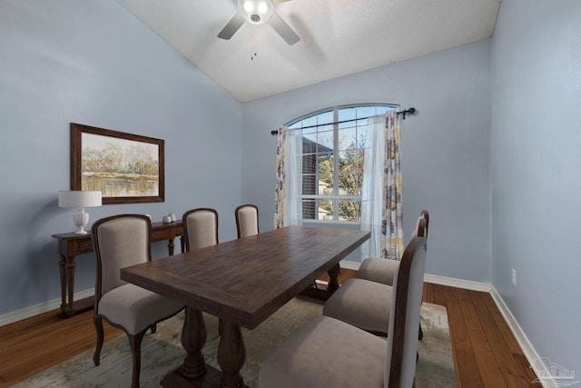 dining space with ceiling fan and wood-type flooring