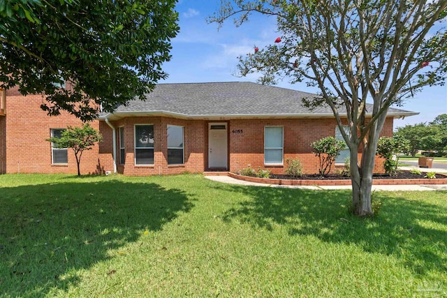 ranch-style home featuring a front yard