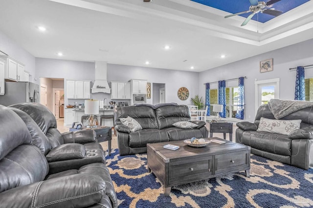 living room with sink and ceiling fan