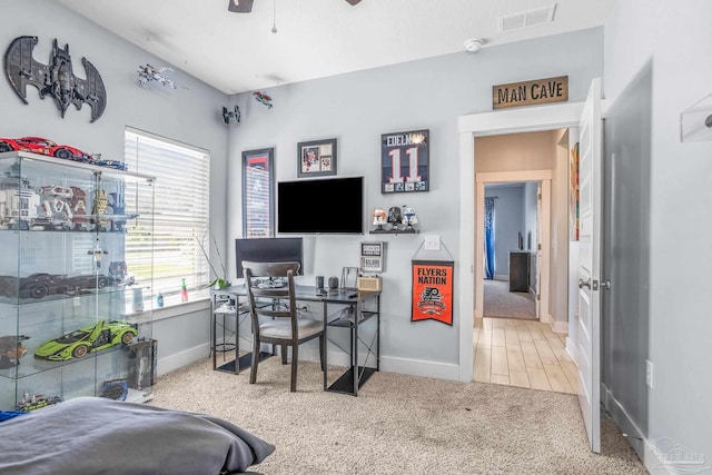 office with ceiling fan and carpet flooring