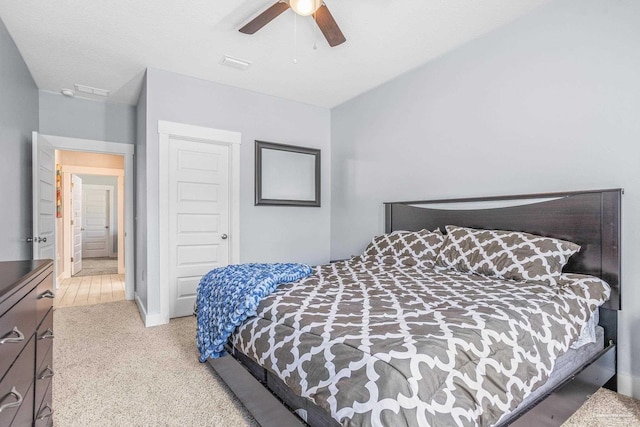 bedroom featuring light carpet and ceiling fan