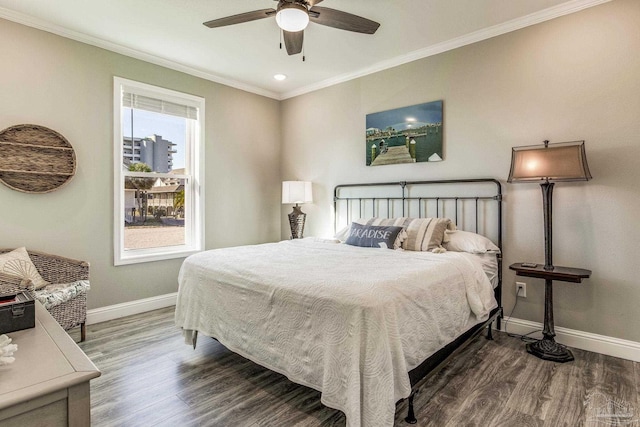 bedroom with dark hardwood / wood-style flooring, ornamental molding, and ceiling fan