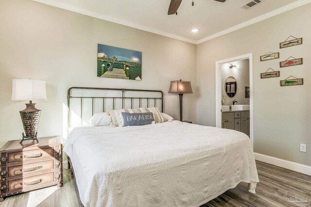 17290 Perdido Key Dr Unit A1, Pensacola, FL 32507 - bedroom featuring ensuite bathroom, baseboards, visible vents, wood finished floors, and crown molding