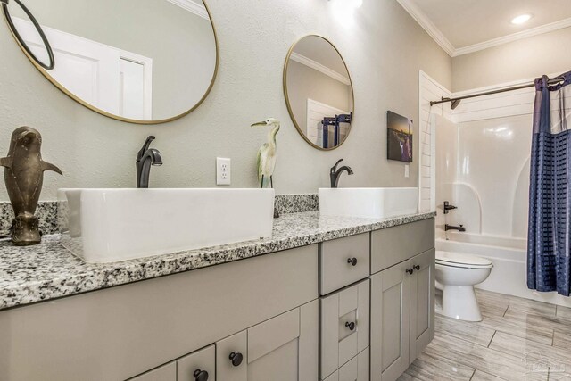 17290 Perdido Key Dr Unit A1, Pensacola, FL 32507 - bathroom with shower / bath combination with curtain, double vanity, crown molding, and a sink