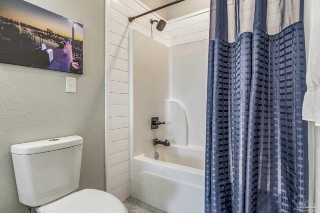 bathroom with toilet and shower / bathtub combination with curtain