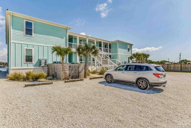 17290 Perdido Key Dr Unit A1, Pensacola, FL 32507 - view of front of home with board and batten siding and fence