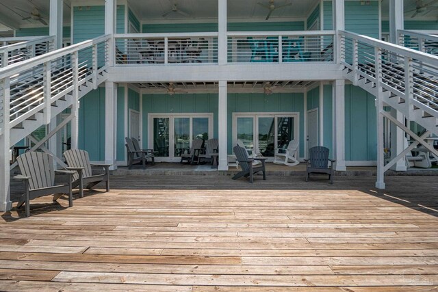 17290 Perdido Key Dr Unit A1, Pensacola, FL 32507 - deck featuring a ceiling fan and stairway