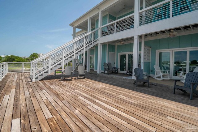 17290 Perdido Key Dr Unit A1, Pensacola, FL 32507 - wooden deck featuring ceiling fan and stairway