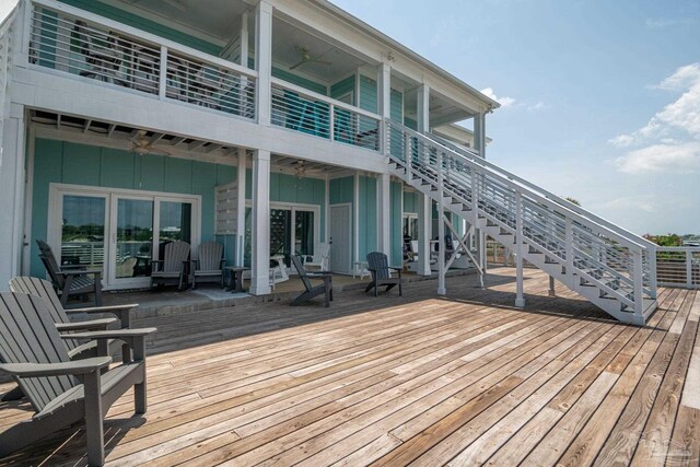 17290 Perdido Key Dr Unit A1, Pensacola, FL 32507 - wooden terrace featuring ceiling fan and stairs