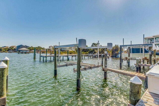 17290 Perdido Key Dr Unit A1, Pensacola, FL 32507 - view of dock featuring boat lift and a water view
