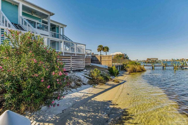 17290 Perdido Key Dr Unit A1, Pensacola, FL 32507 - property view of water with stairs, a boat dock, and fence
