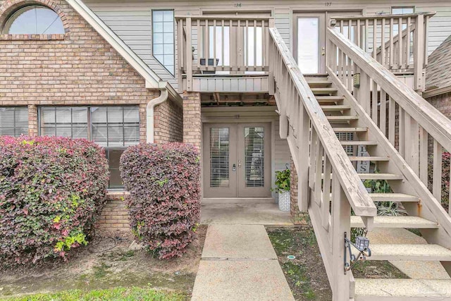 entrance to property with french doors and brick siding