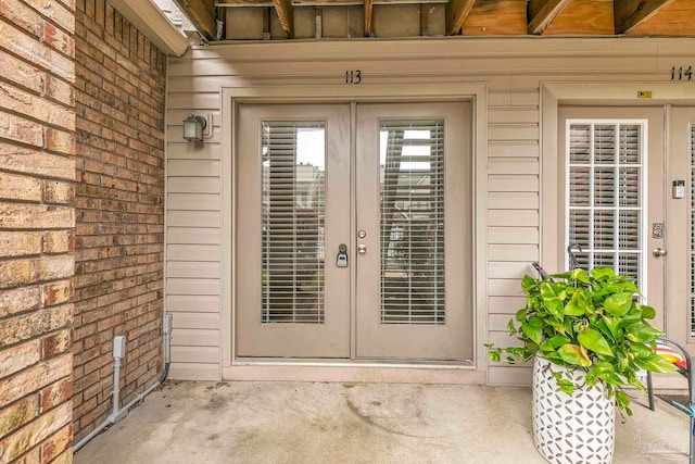 view of exterior entry featuring french doors