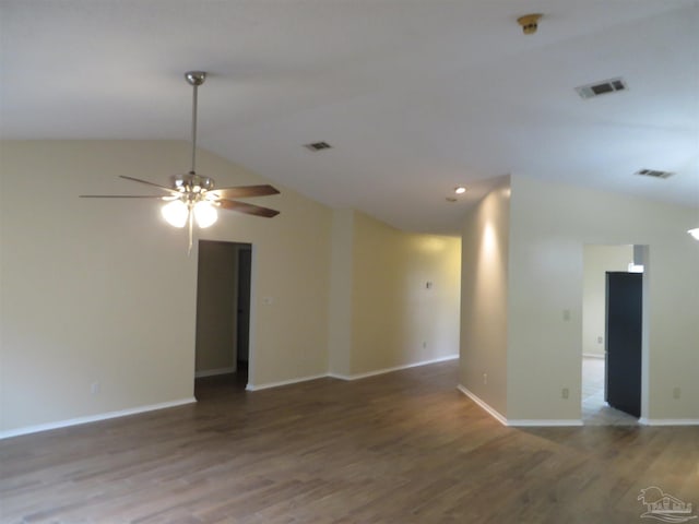 spare room with ceiling fan, hardwood / wood-style flooring, and vaulted ceiling