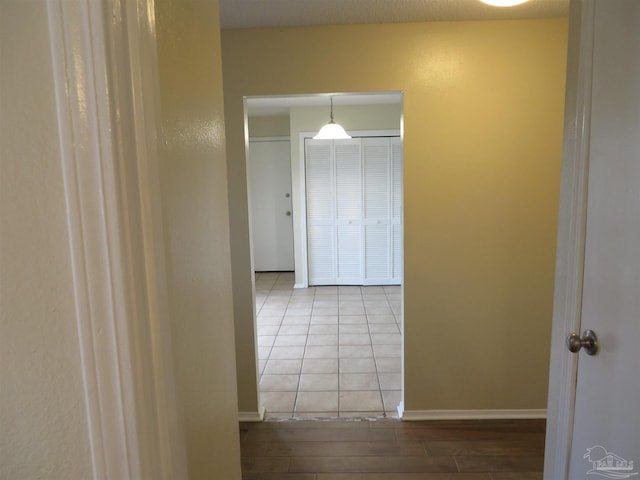 hallway with hardwood / wood-style floors