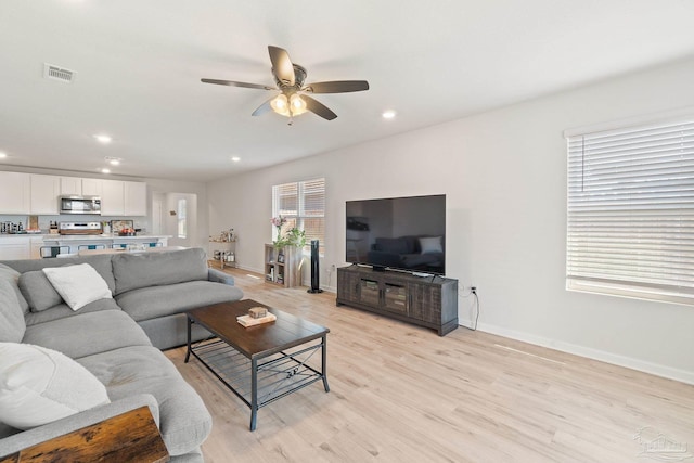 5252 Peach Dr, Pace, FL 32571 - living room featuring light wood-style floors, ceiling fan, recessed lighting, and baseboards