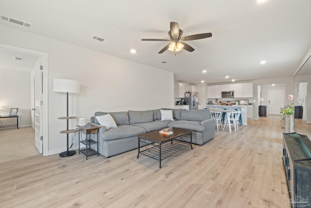 5252 Peach Dr, Pace, FL 32571 - living room with a ceiling fan, light wood-style flooring, recessed lighting, and baseboards